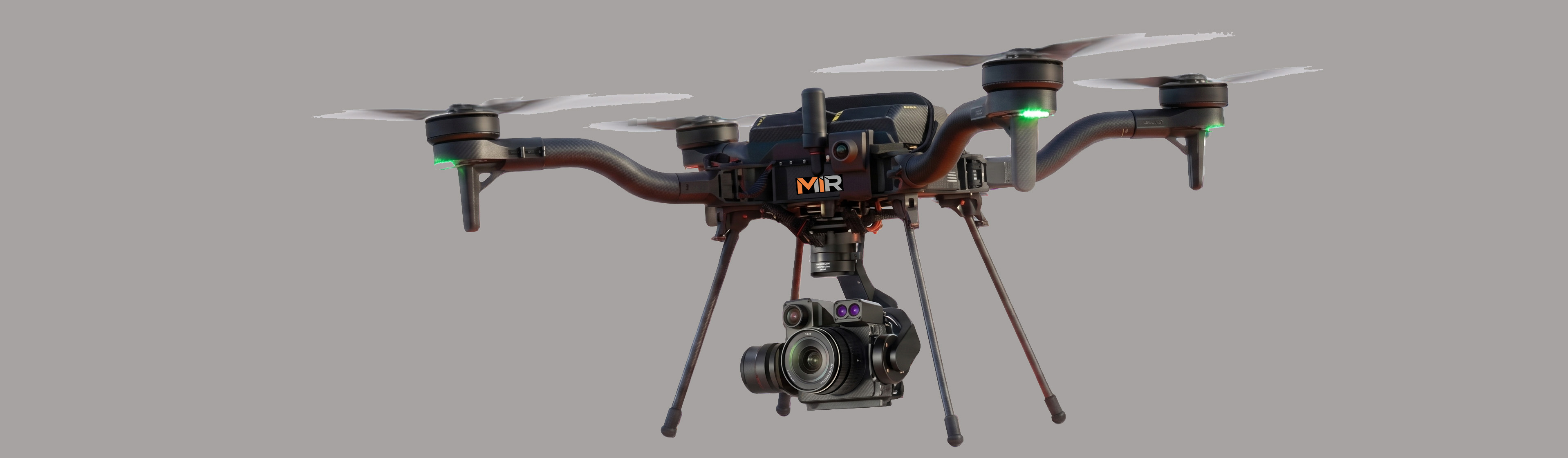 MIR Blue UAS-cleared Freefly Astro in flight with gimbal-mounted RGB and thermal camera payload