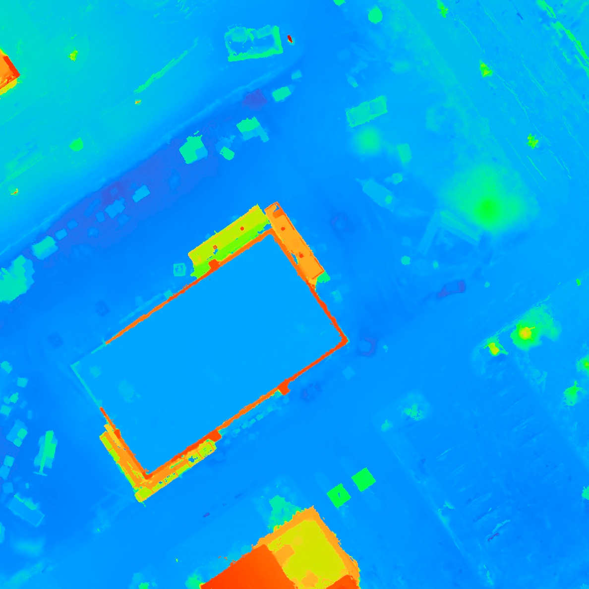 Colorized digital surface model of the Westfield construction site, elevations mapped blue (low) through green to red (high) with the central foundation standing out
