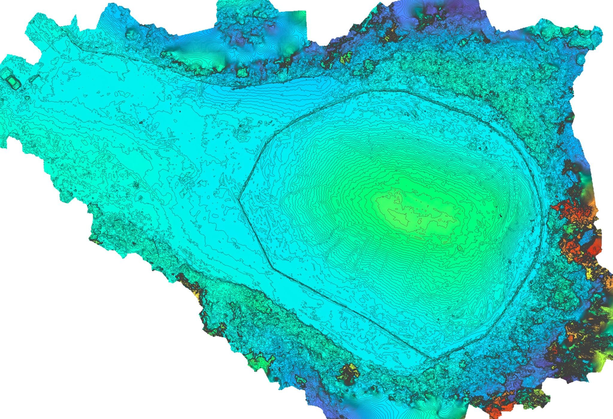 Colorized elevation surface of the stockpile site overlaid with dense concentric contour lines, the central mound rising through blue and cyan to a green-yellow crest