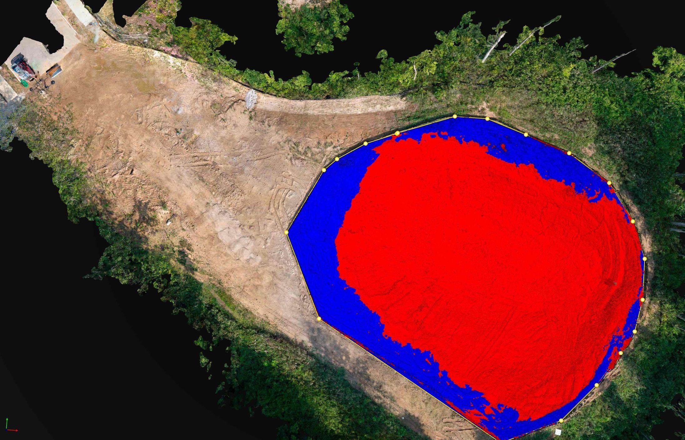 RTK photogrammetry stockpile volume measurement — the pile enclosed by a yellow boundary polygon with a blue-to-red cut/fill heatmap showing material above and below the base surface, over the true-color orthomosaic