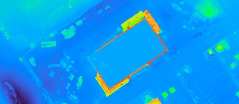 Colorized digital surface model of the same site, elevations mapped from blue lows through green to red highs