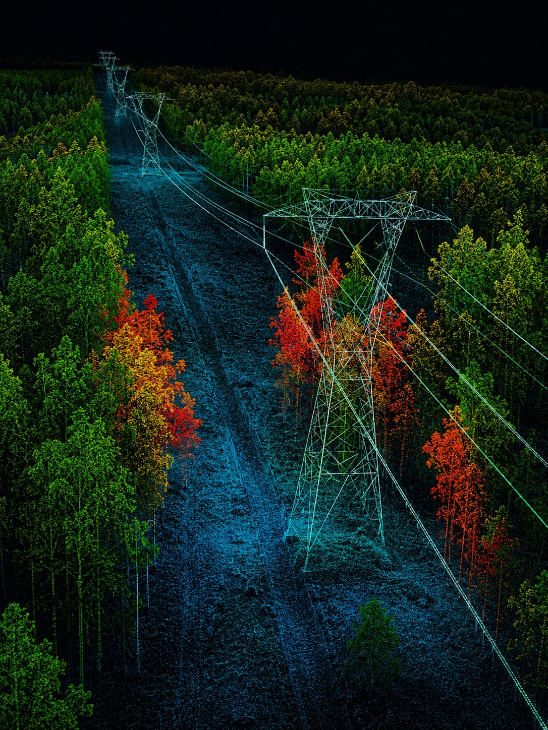 Colorized aerial LiDAR point cloud of a site, shaded by elevation to show terrain, structures, and ground surface