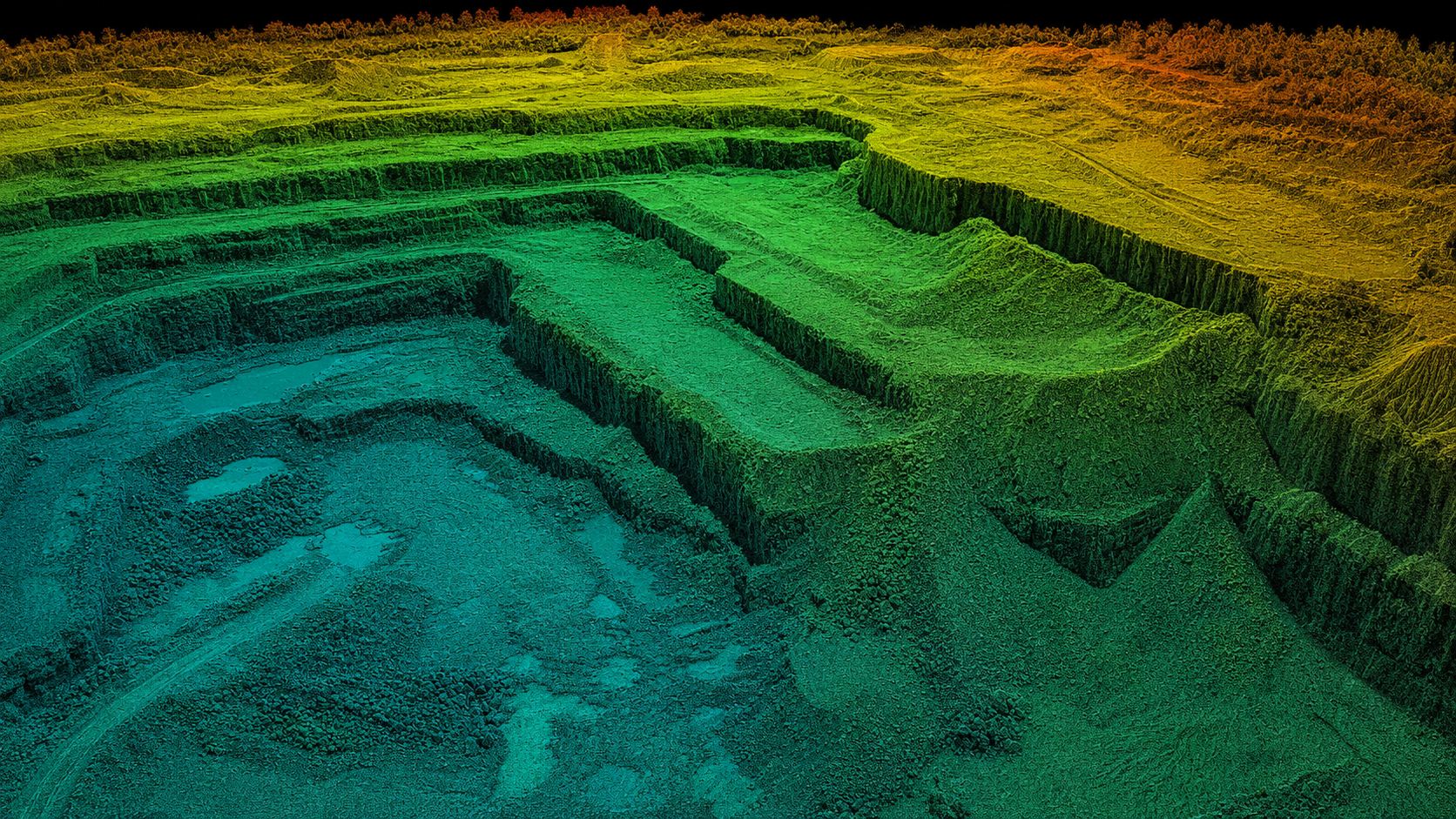 Colorized LiDAR point cloud of an open-pit quarry with a blue-to-orange elevation ramp showing stepped benches and highwalls, exported as a LAS deliverable
