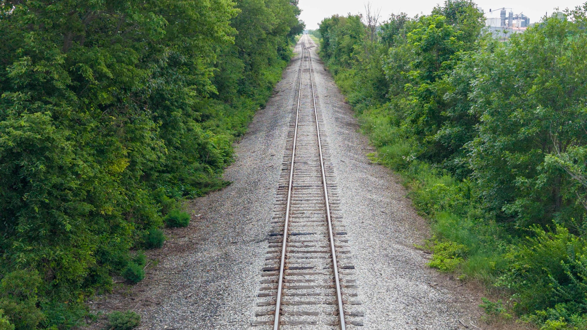 Aerial view of a rail corridor running through the landscape